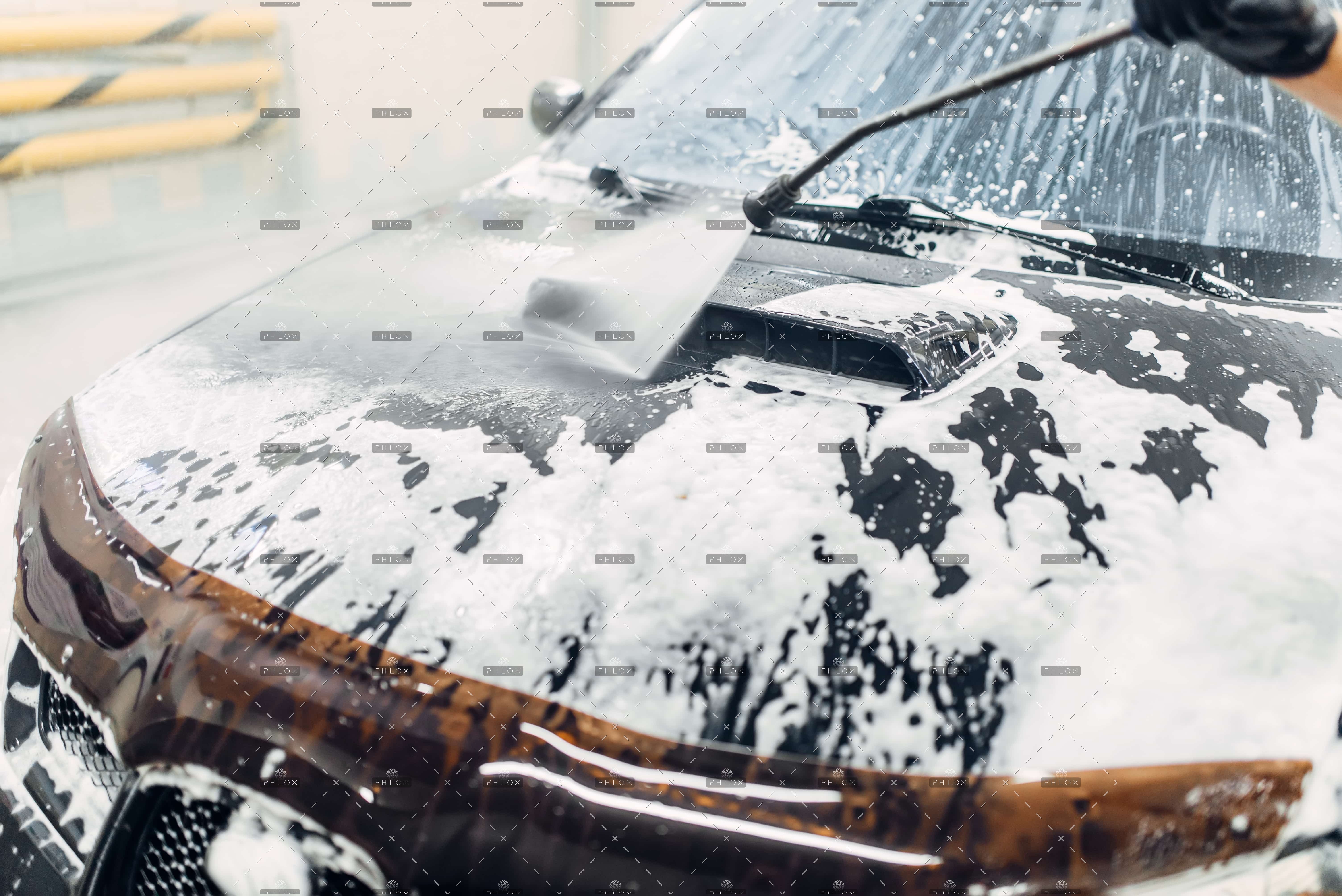 demo-attachment-76-op_carwash-service-car-cleaning-top-view-on-hood-NXERU2A